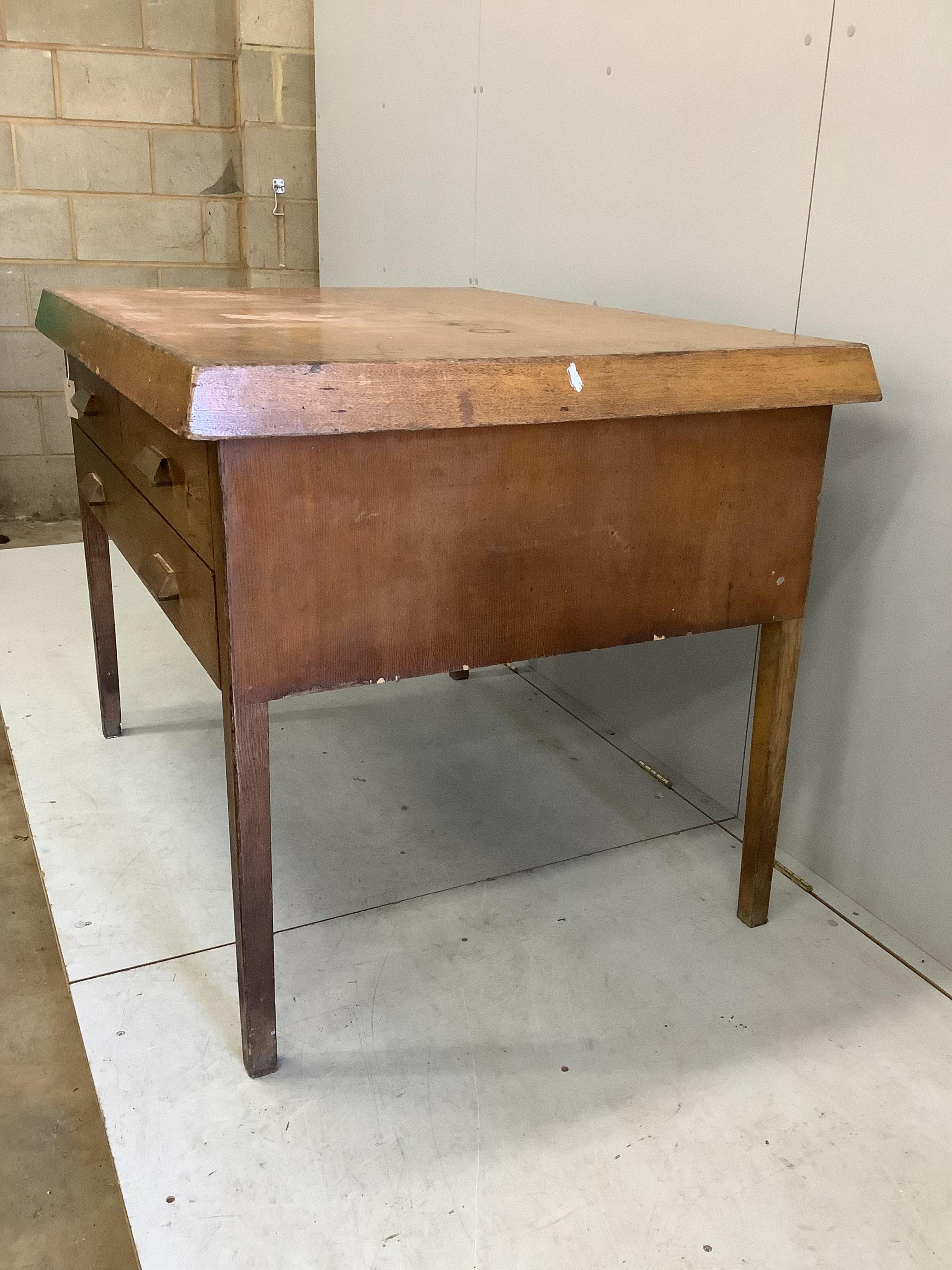 An early 20th century Scandinavian oak three drawer plan chest, width 125cm, depth 94cm, height 92cm. Condition - fair